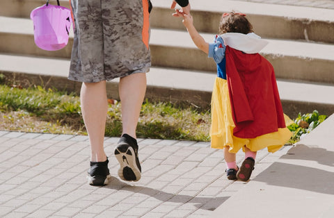 little girl wearing snow white costume