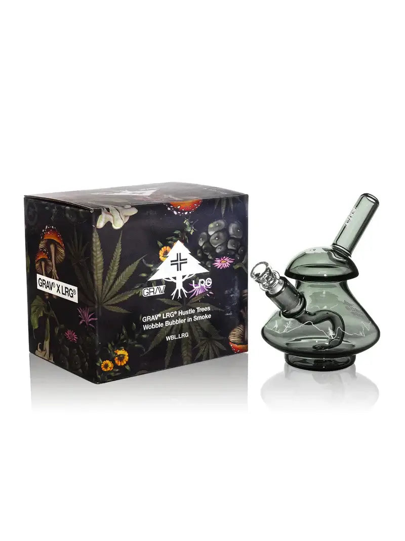 GRAV x LRG Hustle Trees Wobble Bubbler in smoke grey with decorative packaging featuring cannabis-inspired design.