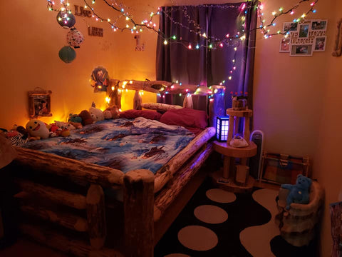 kids room with log bedroom set decorated with lights