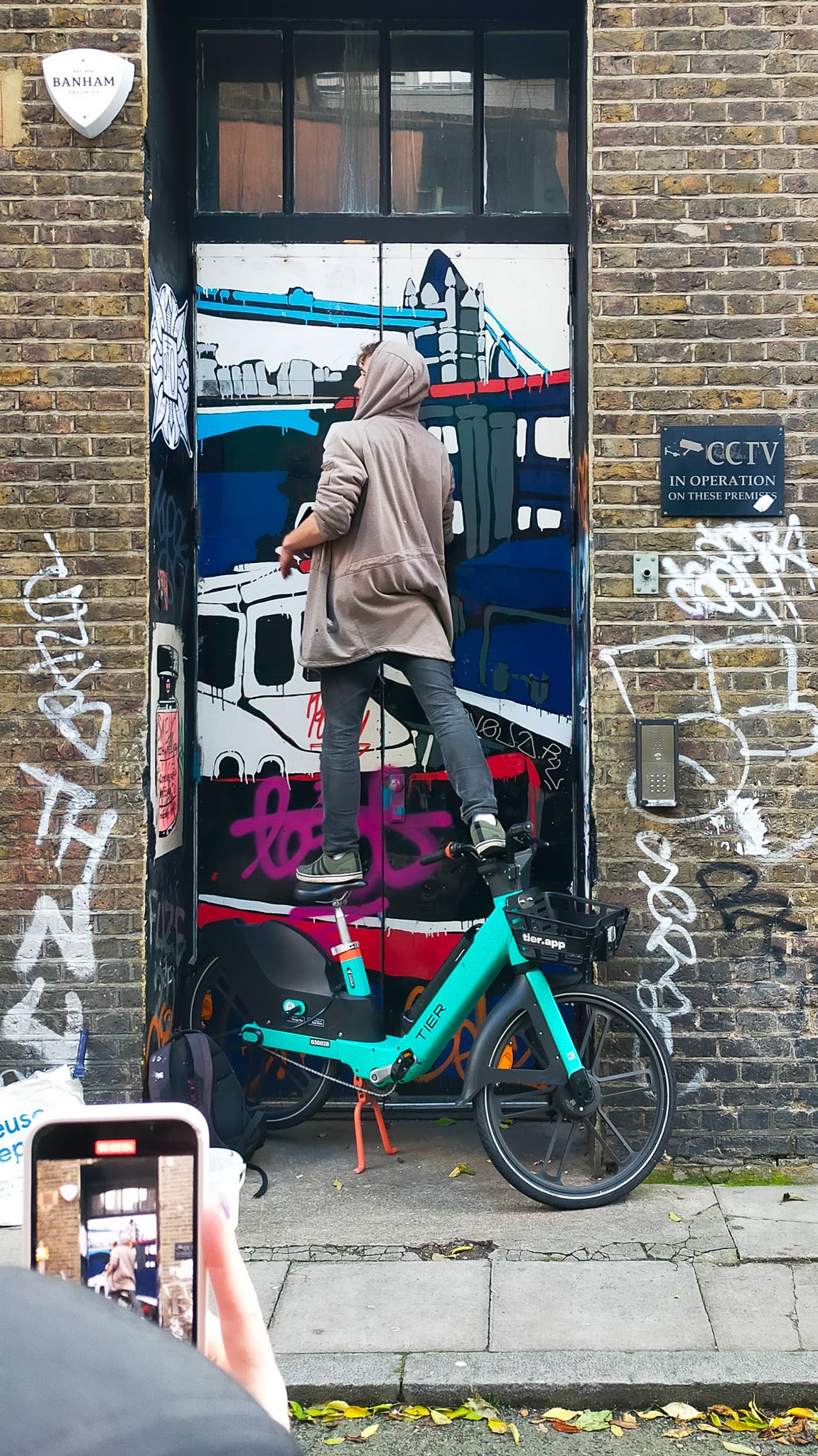 dublin artist Raise pasting up on Whitby Street