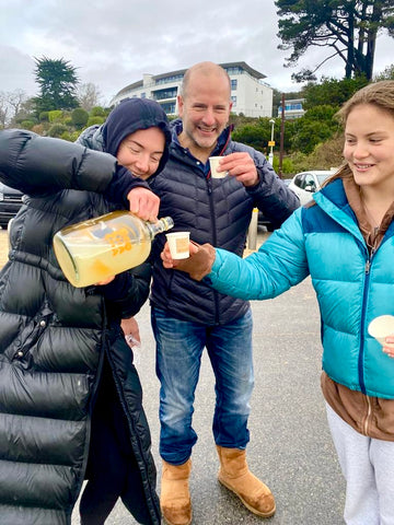 Moment our founder, Hebe, shares her home brew kombucha with members of her local, sea swimming group, early in the morning after a cold winter dip - boochacha