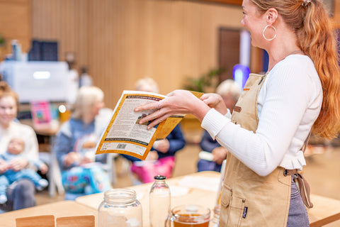 Hebe Ibbotson, our proud founder teaching a kombucha brewing workshop, with one participant being a new, young mother, bringing her 3 month old baby to the class with her - boochacha