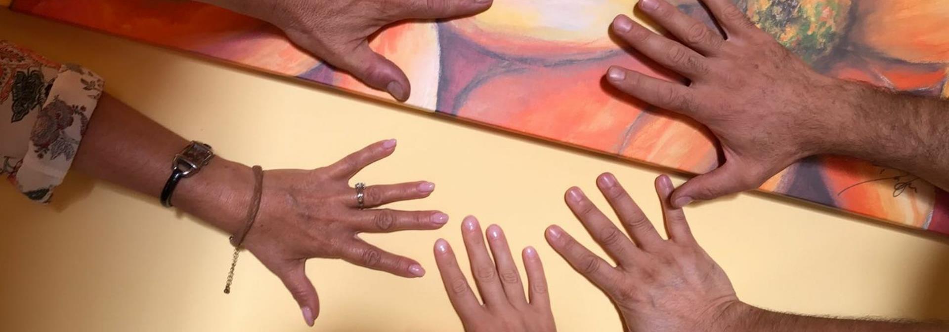 Hands of people from the Tana Libera Association