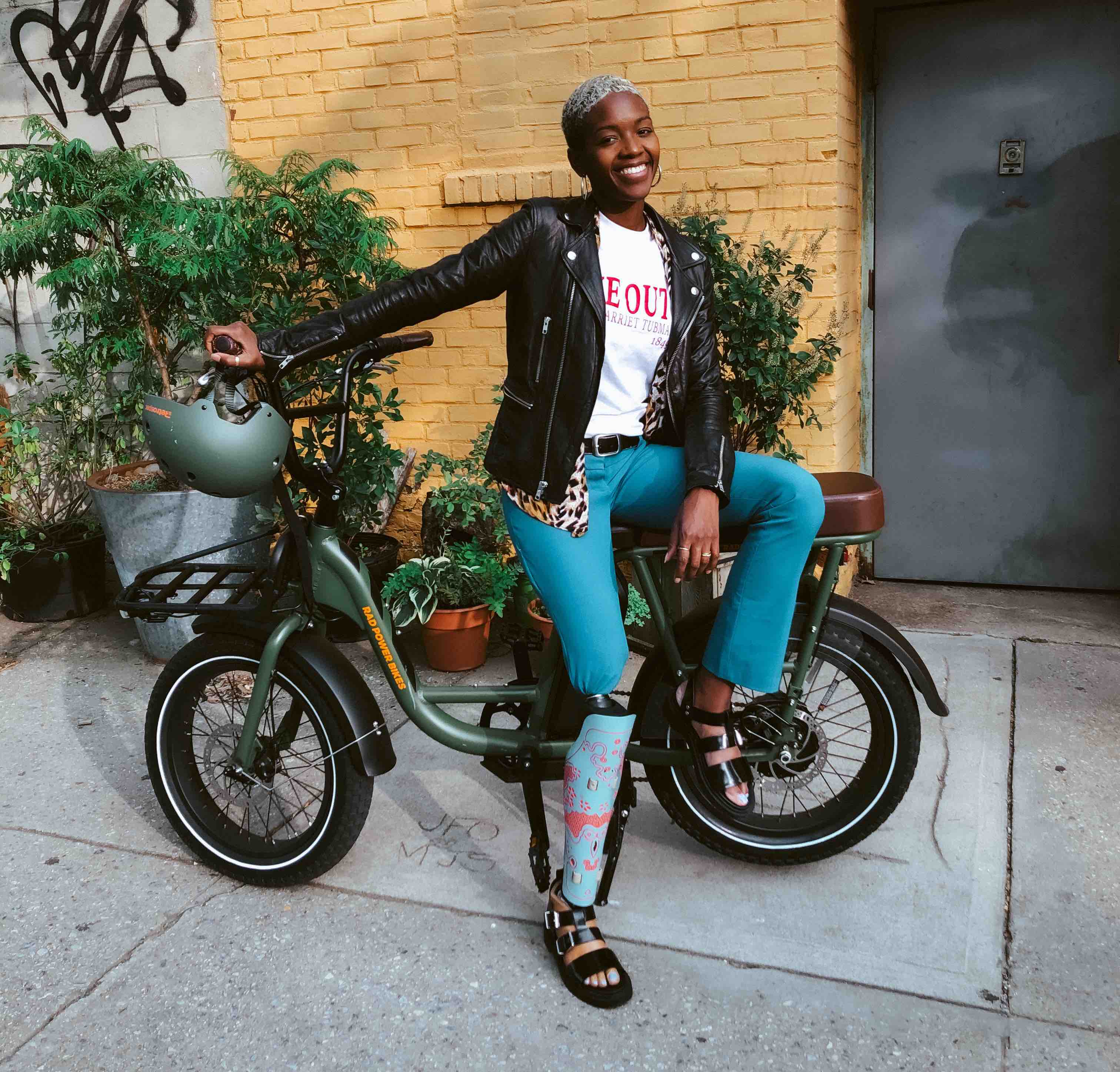 Fashion model Kiara Marshall poses with a RadRunner electric utility bike.