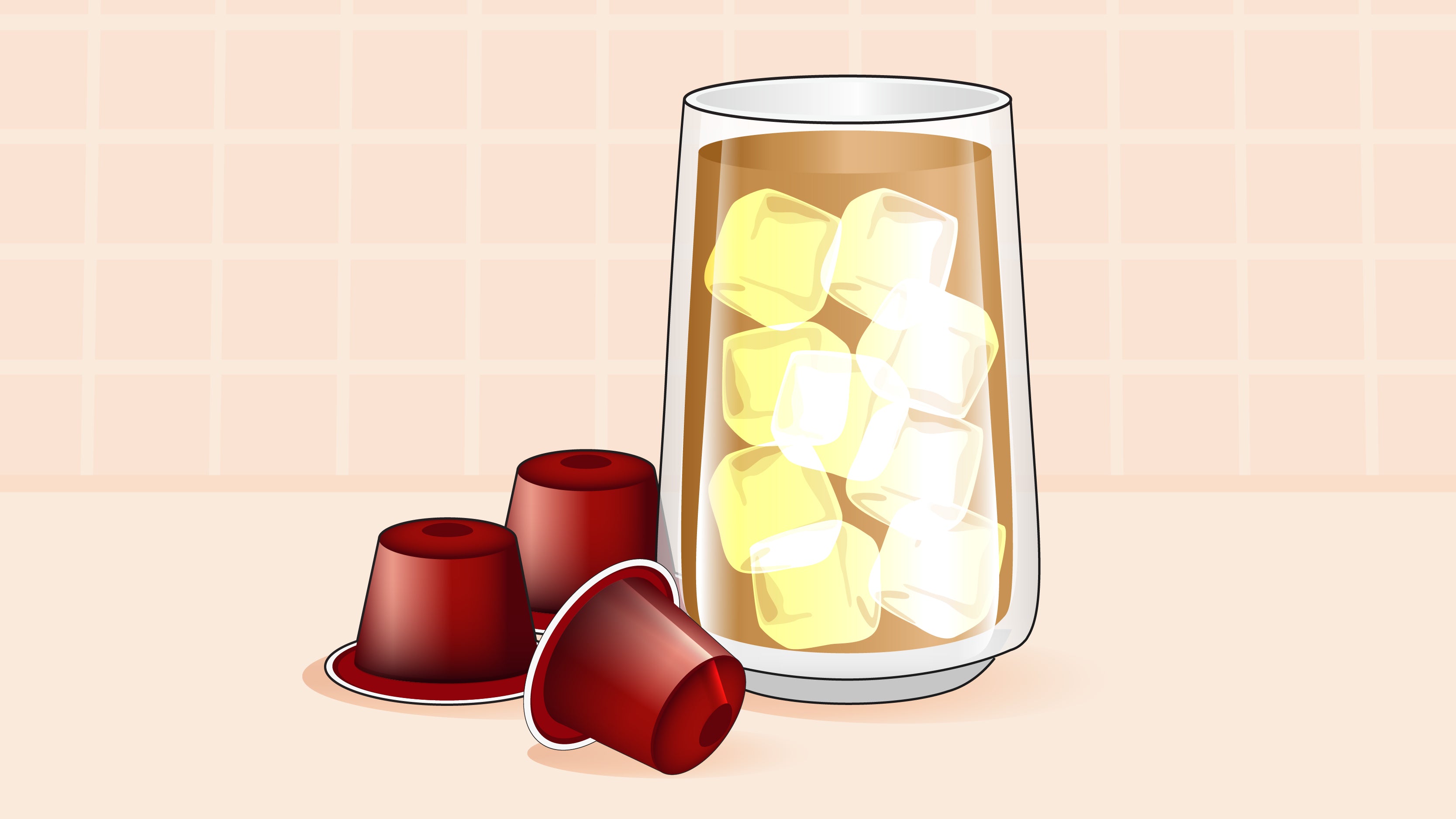 Glass of iced coffee with ice cubes next to three red Nespresso pods.