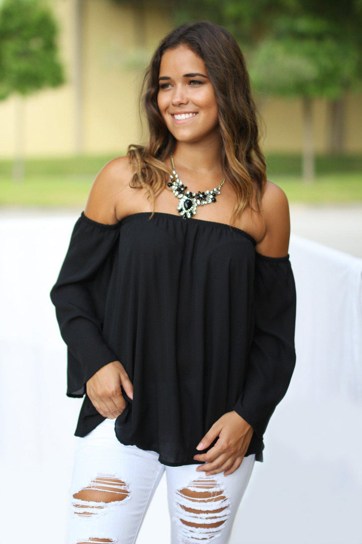 off shoulder black top outfit