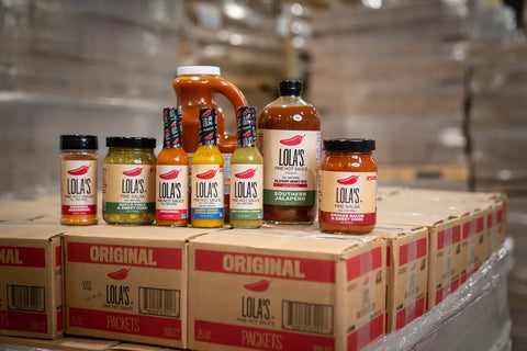 lola's hot sauce main product line up in warehouse boxes