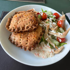 Two CRIMPiT snacks served with salad