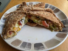 A toasted snack with vegetable filling