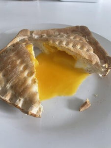 A toasted snack with egg filling