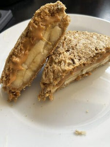 A toasted snack filled with banana and peanut butter