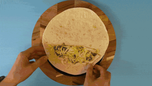 A GIF of a tortilla being sealed in the CRIMPiT Tortilla Sealer