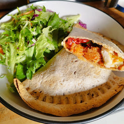 A wrap filled with halloumi and tomato