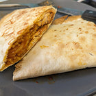 A tortilla filled with chicken and spaghetti