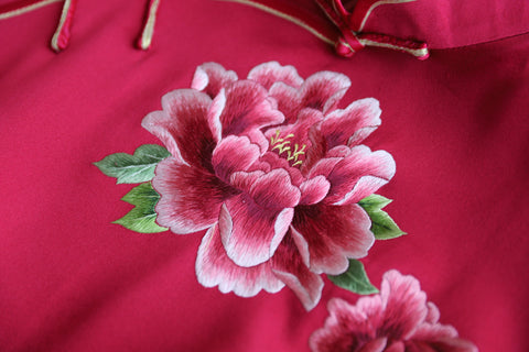 Close-up of hand embroidery on a Chinese wedding dress with peony embroidery