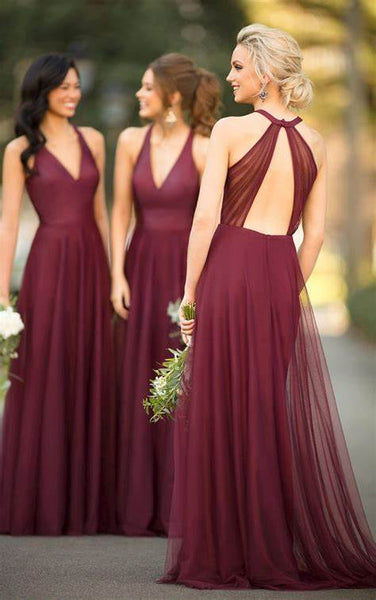 three girls wearing burgundy bridesmaid dress