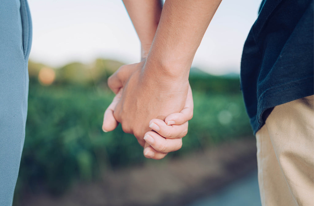 Loving with Autism: Understanding Unique Expressions of Affection Blog Image hands holding