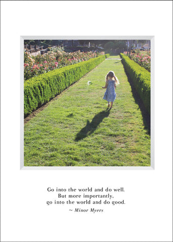girl walking in a park carrying a flower - graduation greeting card