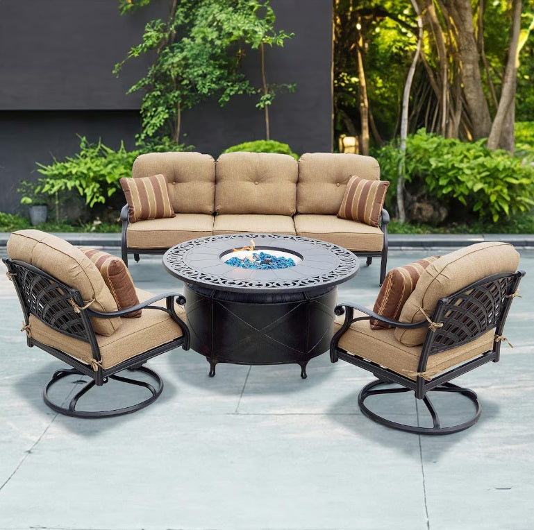 Nassau 4 Pc Cast Aluminum Fire Pit Seating Set w/ 47 Inch Table w/ Swivel Rockers & Throw Pillows in Antique Bronze/Sesame