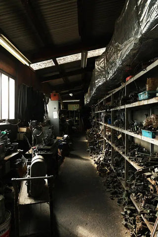 A factory room filled with loom parts.
