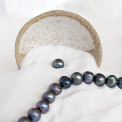 black pearls on sand