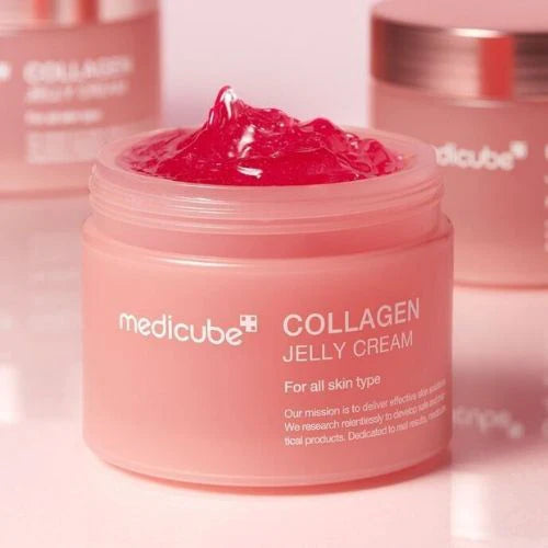 Pink jar of Medicube Collagen Jelly Cream on a reflective surface.