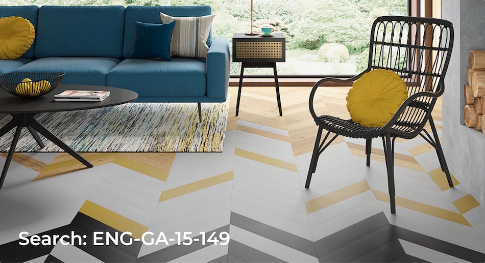 Chevron boards installed in a living room with irregular black, white, yellow and natural looking boards