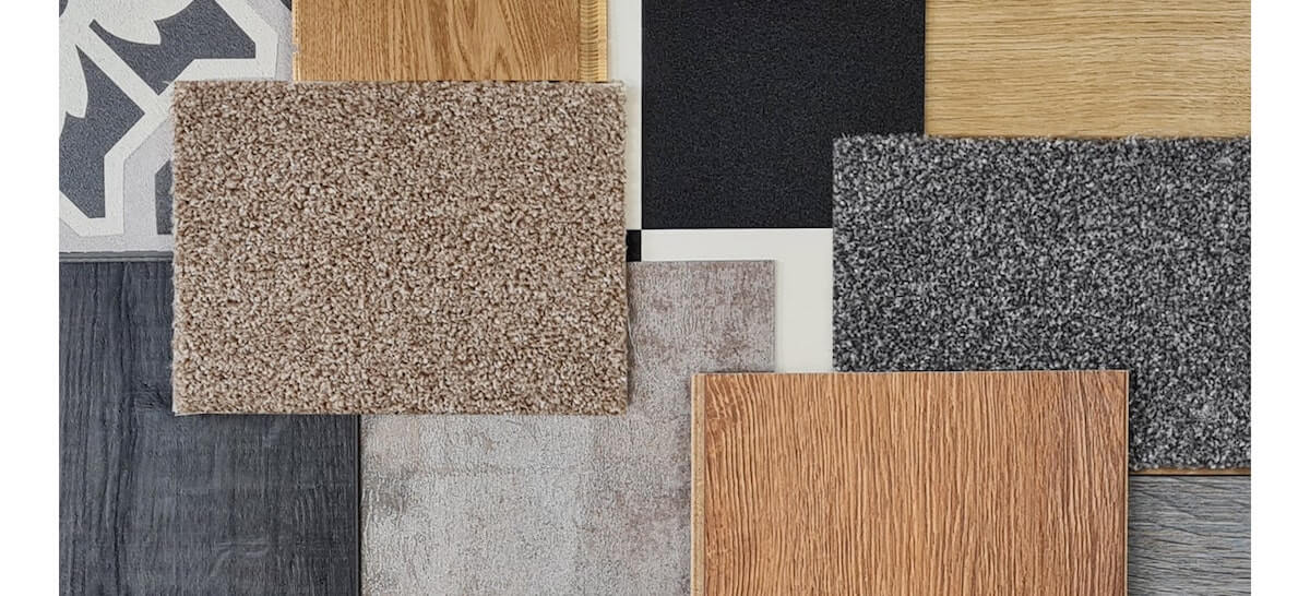 an assortment of samples placed in a mosaic pattern, including laminate, real wood, sheet vinyl and carpet