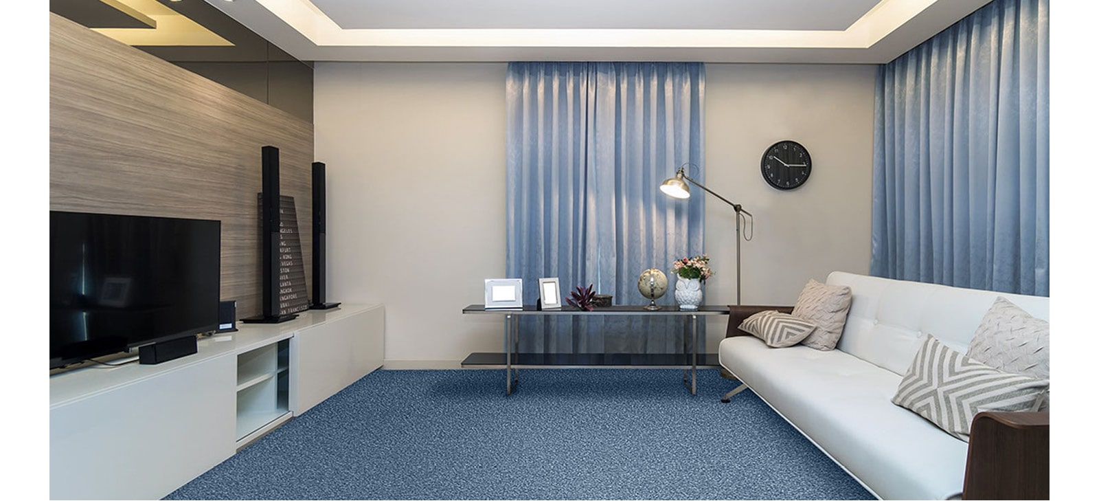 Blue carpet, neutral coloured living room