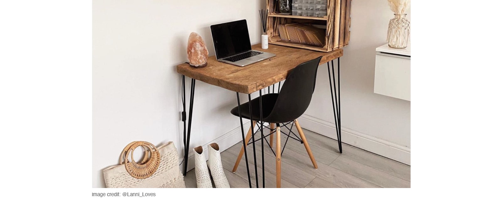 white walled home office with natural wood desk