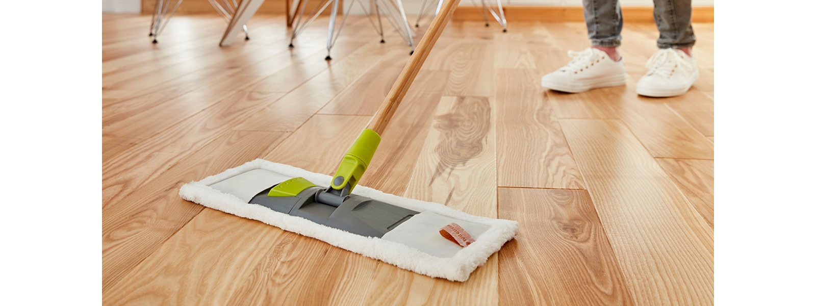 wood floor being swept