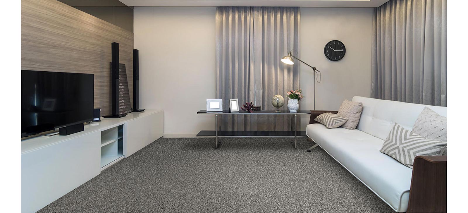 Cosy lounge room set with grey carpet
