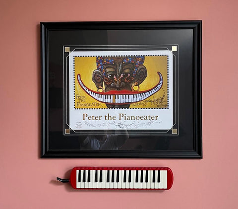 Keyboard hung on the wall with smile art painting.