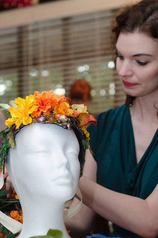 Michelle working on a headdress