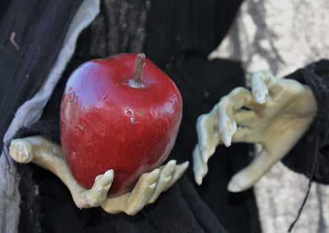 Witch holding poison apple