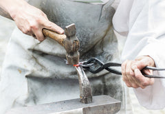 Metal smith at work.