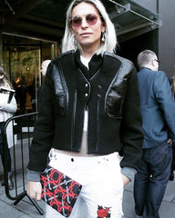 Artist Trinity Tristan at London Fashion Week wearing SEP embroidered clutch