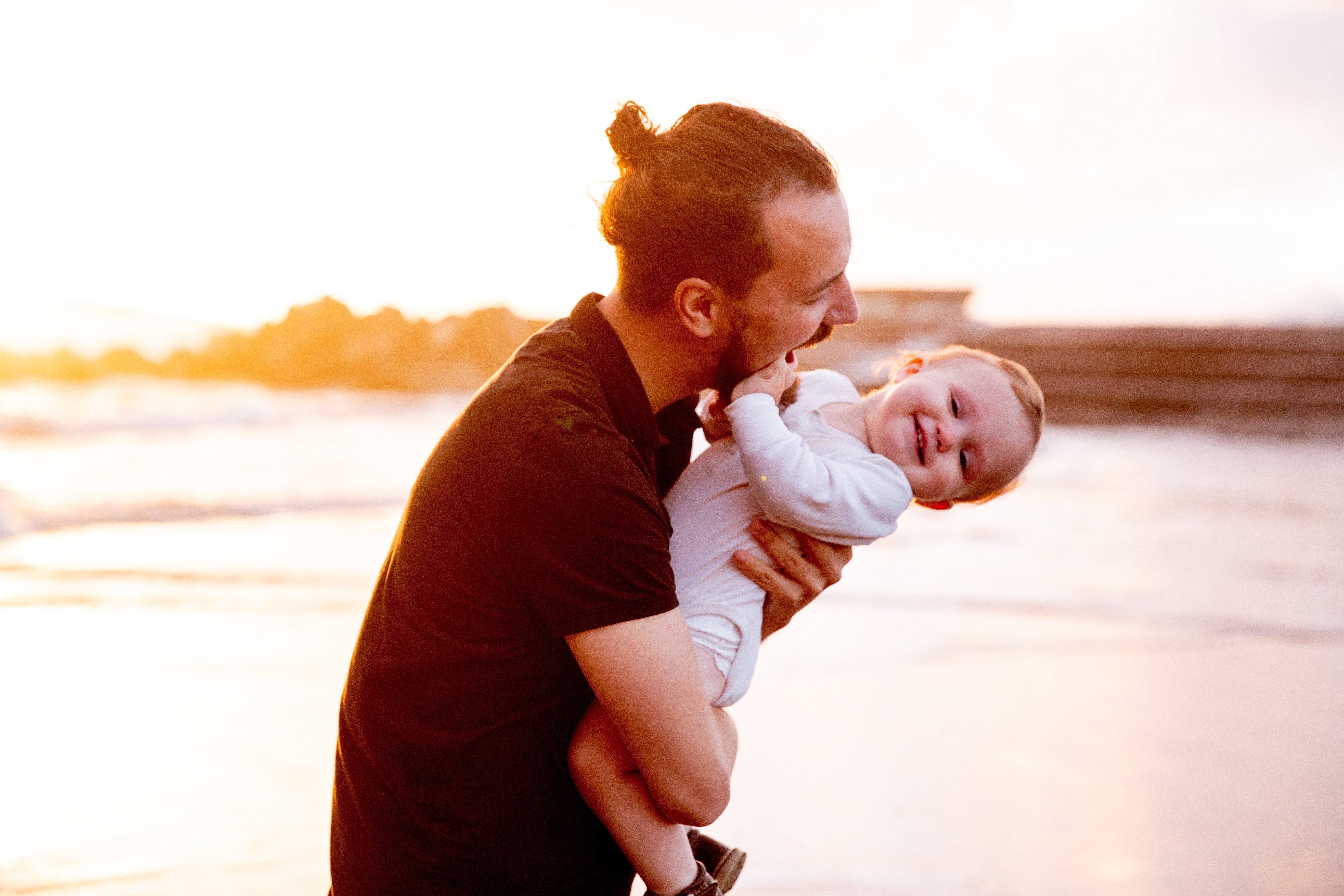 a father holding his baby