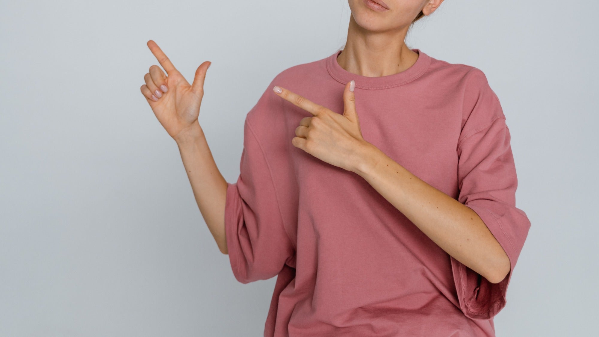 a lady wearing a pink shirt