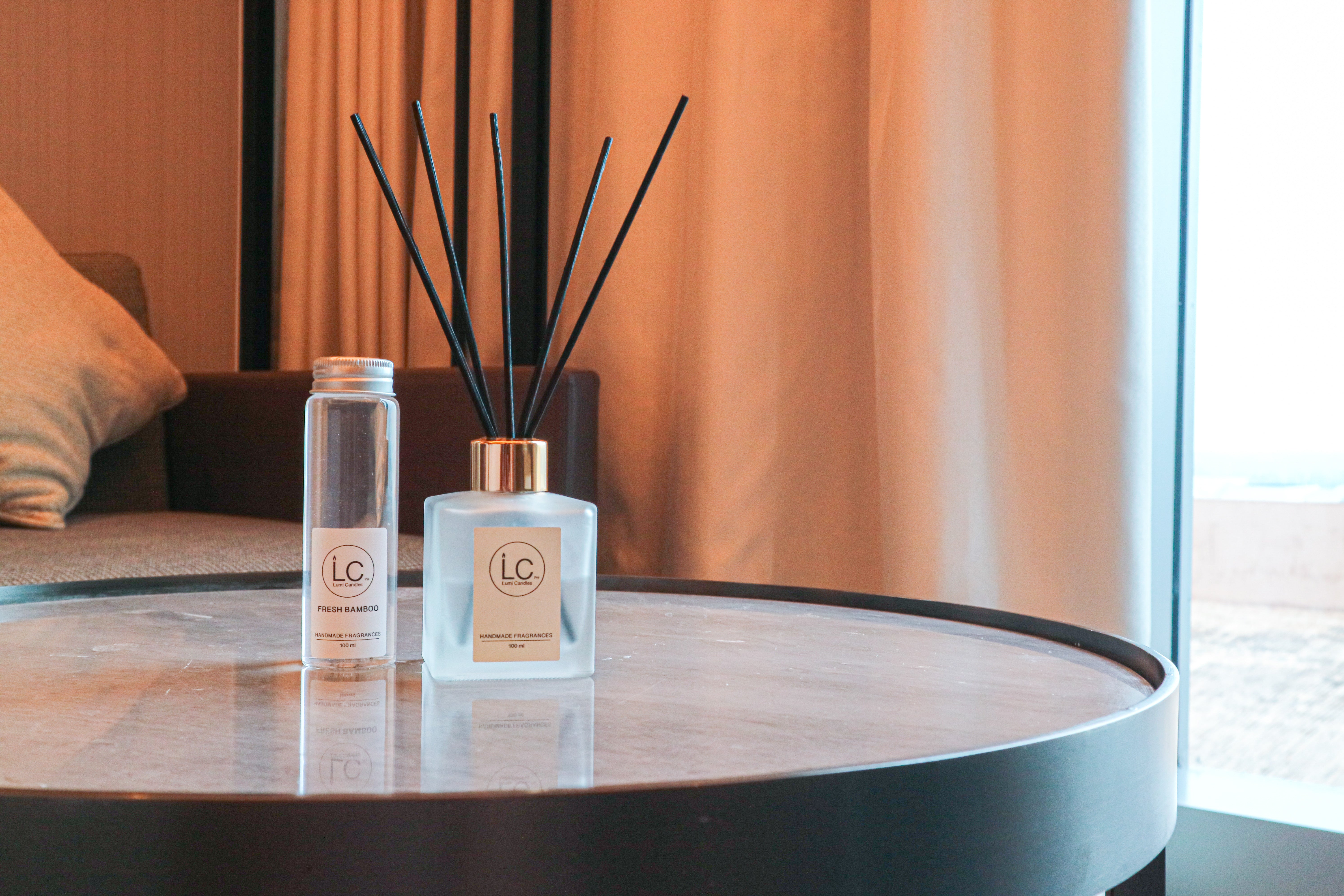 Lumi Candles PH's reed diffuser on top of a roundtable