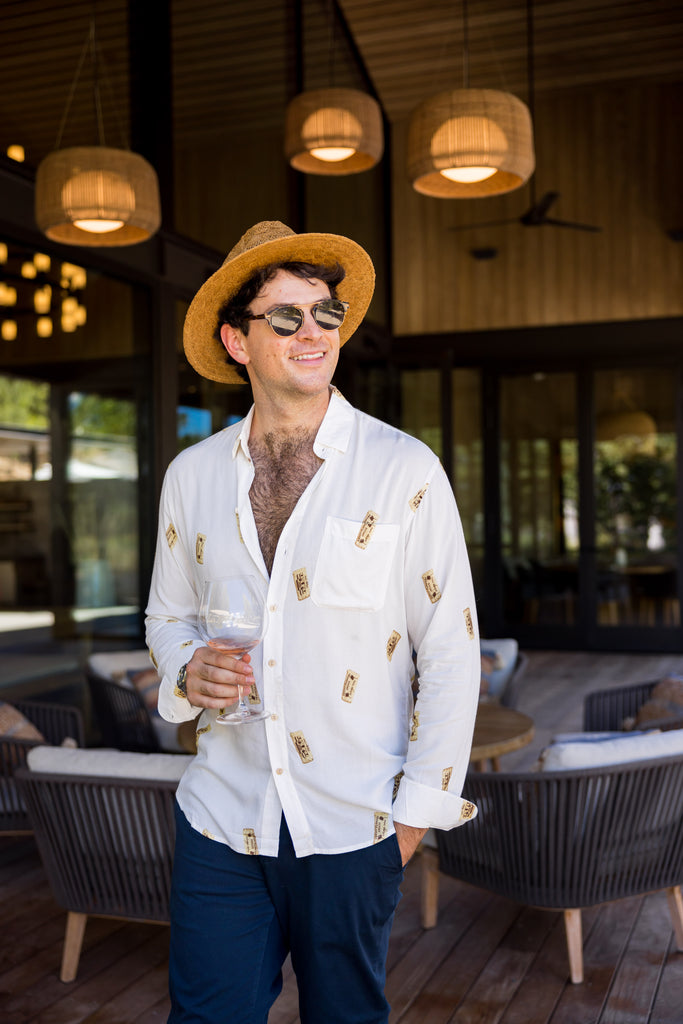 what to wear in Napa as a guy to an upscale dinner. Wine and dine in a mens long sleeve white shirt with wine corks