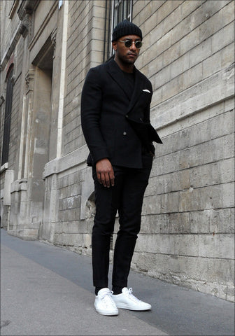 black suit and sneakers