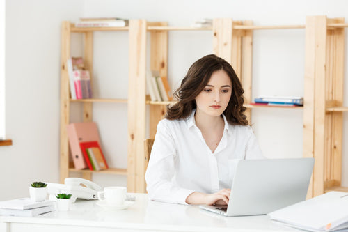 concentrated-young-beautiful-businesswoman-working-laptop-document-bright-modern-office.jpg__PID:aaca035c-622c-4c16-8efb-8b1cd3cf7c29