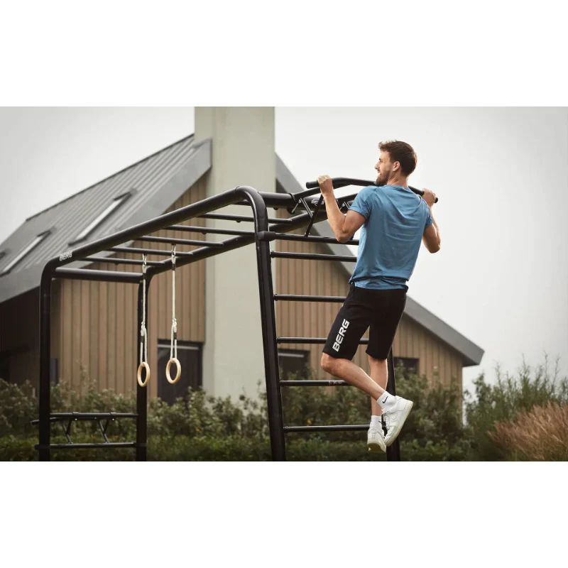 Man performing pull-ups on berg playbase