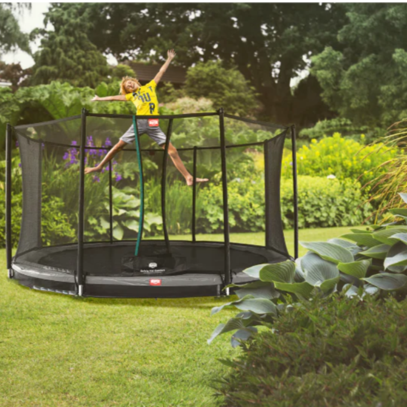 how safe are inground trampolines with boy enjoying trampoline in garden