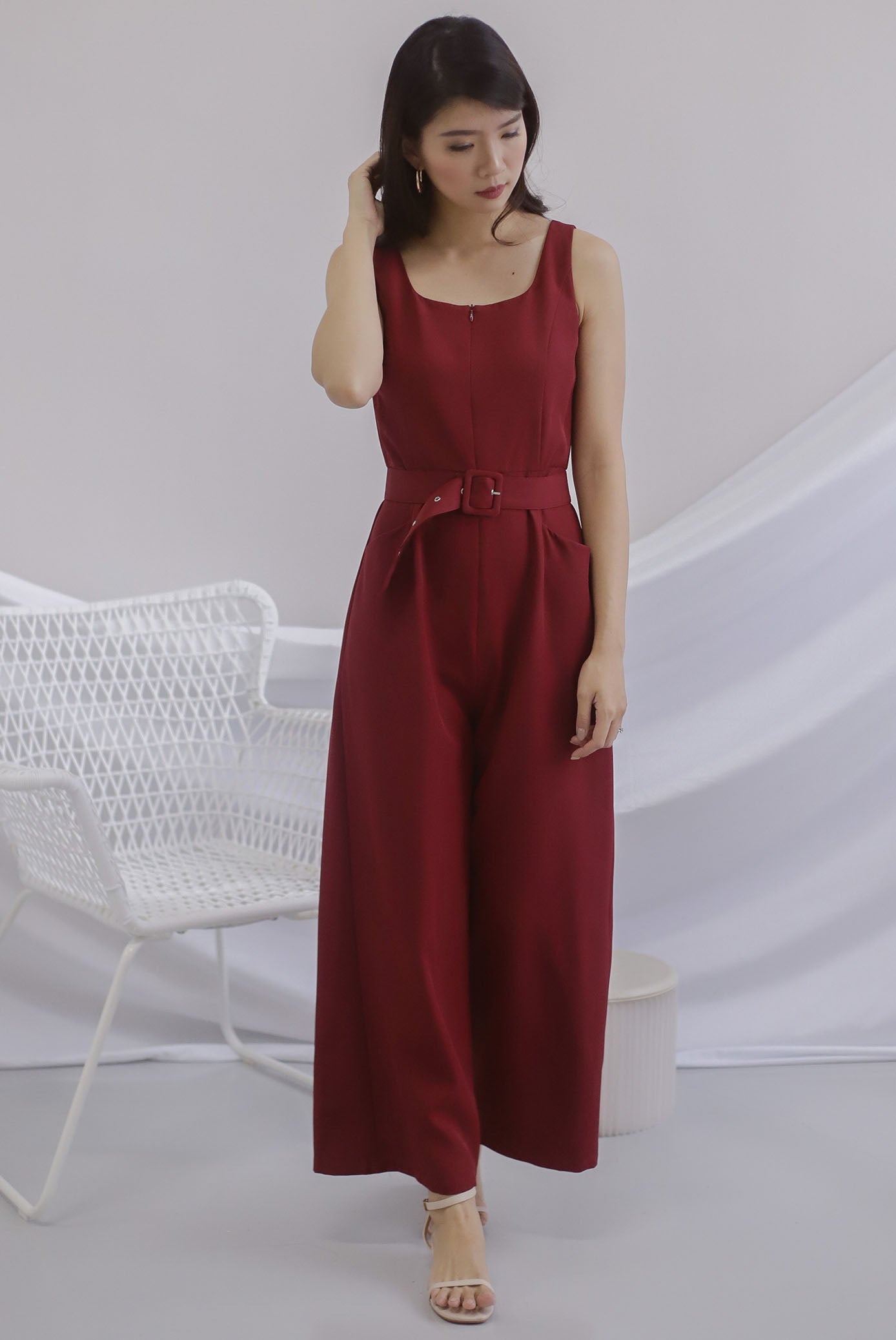 red belted jumpsuit