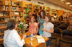 Author Donny Bailey Seagraves signs her children's middle-grade novel, Gone From These Woods, at Borders Bookstore in Athens, Georgia