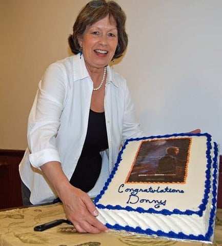 Author Donny Bailey Seagraves with a Gone From These Woods cake at the book launch in the historic Winterville, Georgia train depot in 2009.