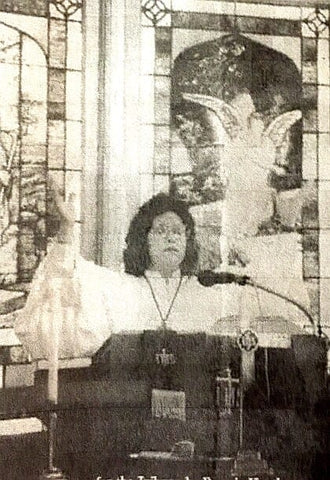 Brenda Mullis, conducting a church service.