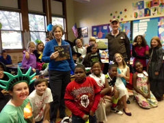 Author Donny Bailey Seagraves and R.E.M. Business Manager Bertis Downs with Students at Barrow School in Athens, Georgia